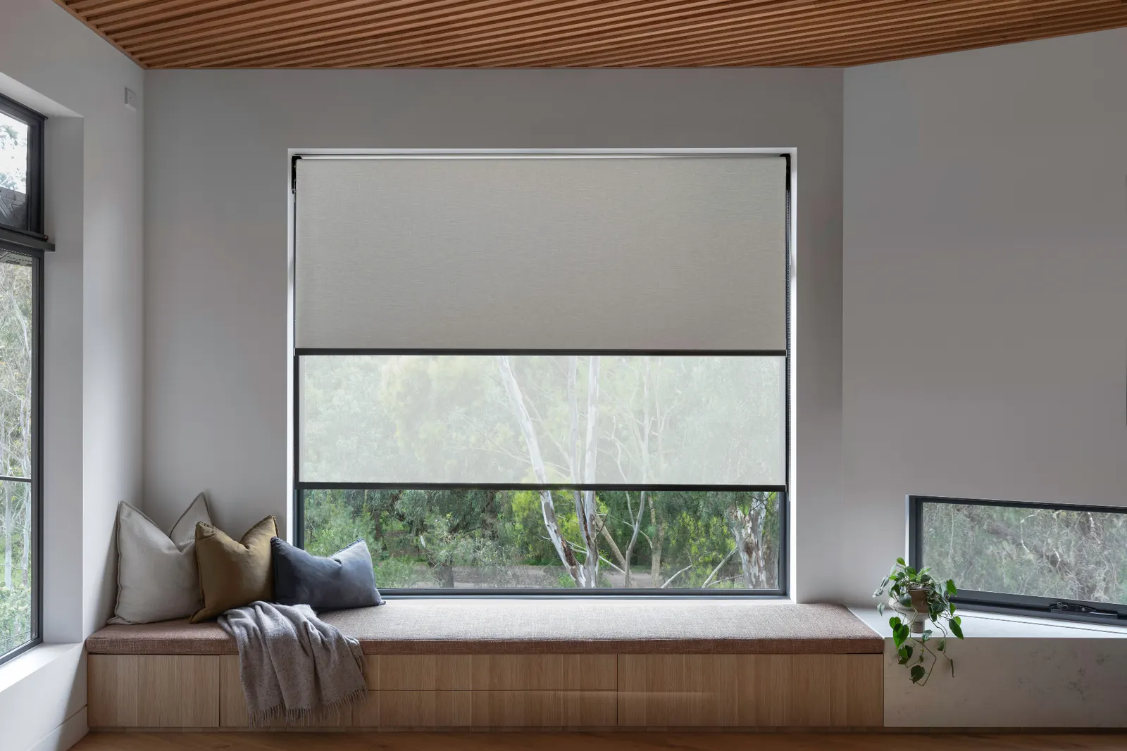 Premium roller blinds in a modern Melbourne home with window seat