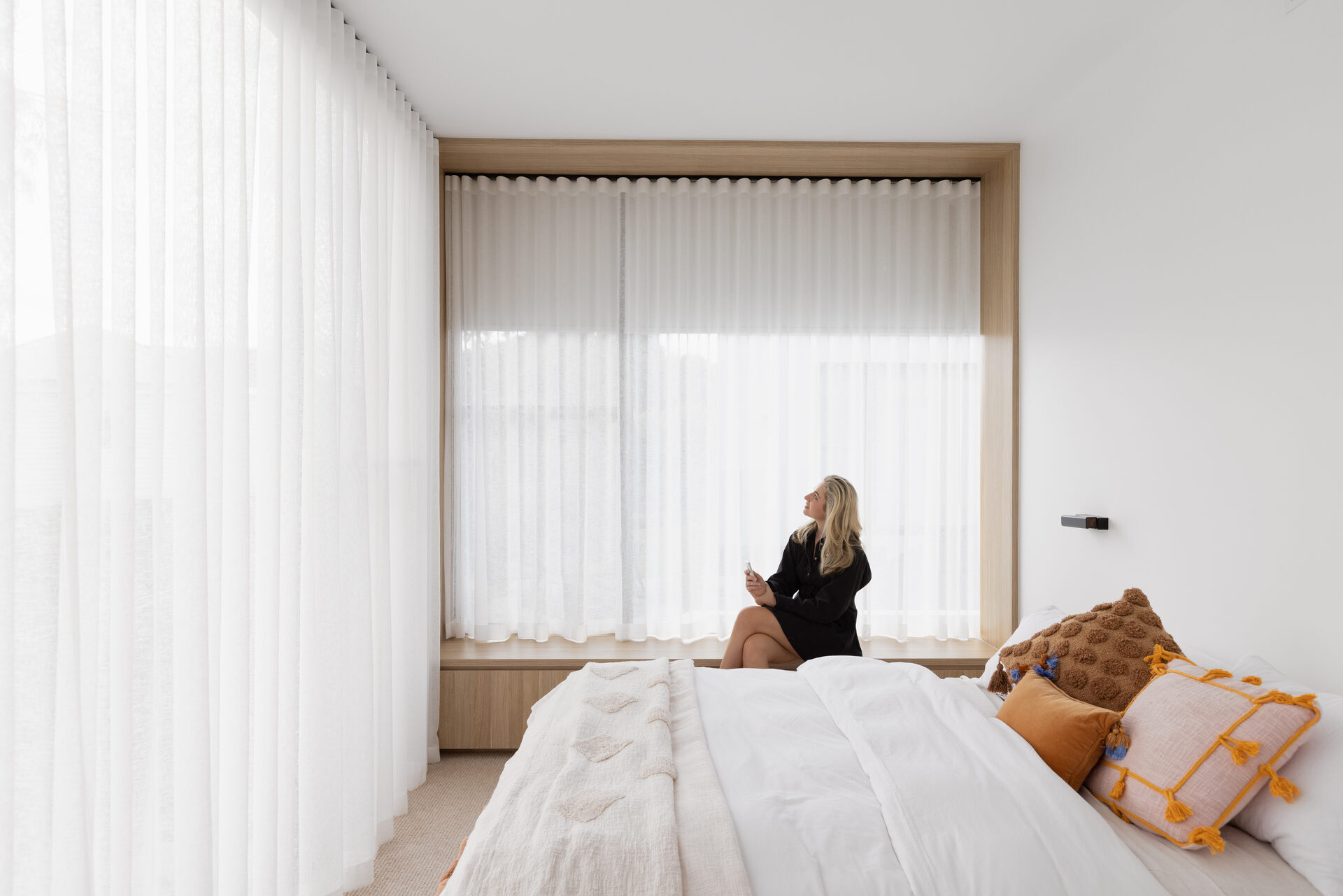 Roller blinds layered with sheer curtains in a Mount Eliza home