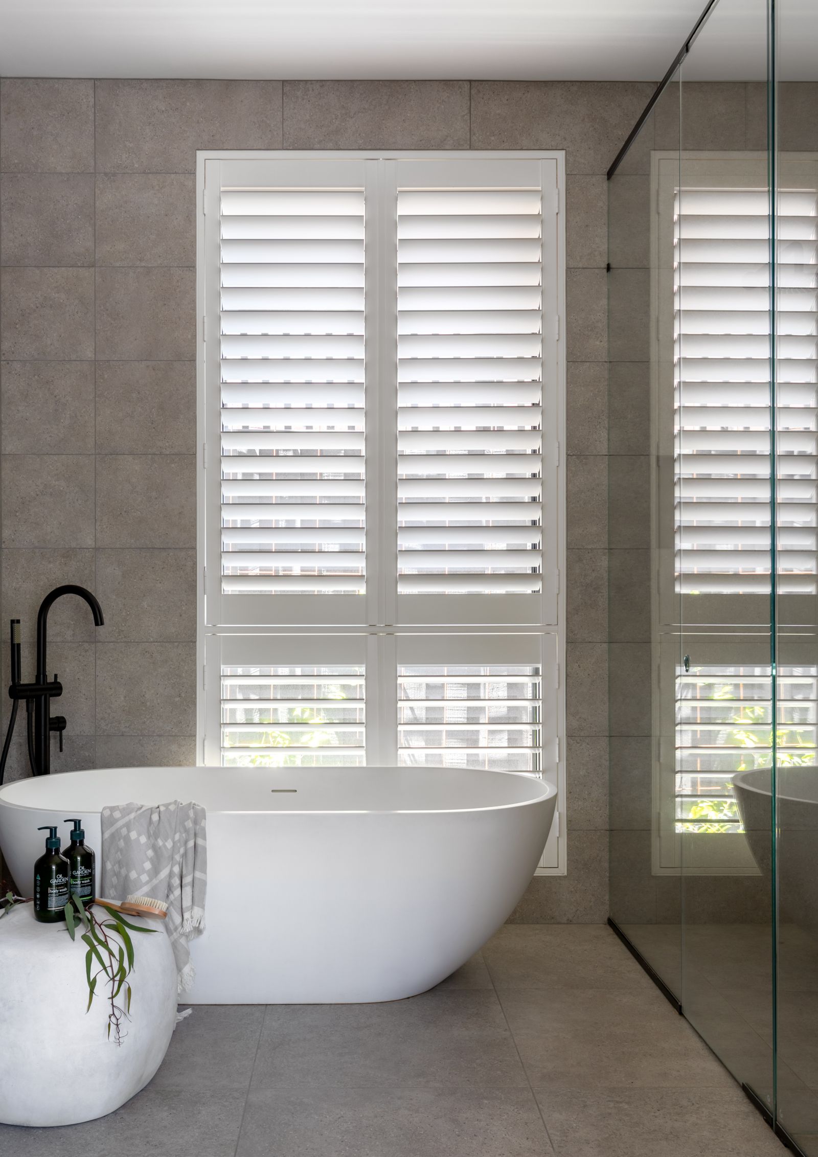 Layered sheers and blockout roller blinds in a contemporary addition