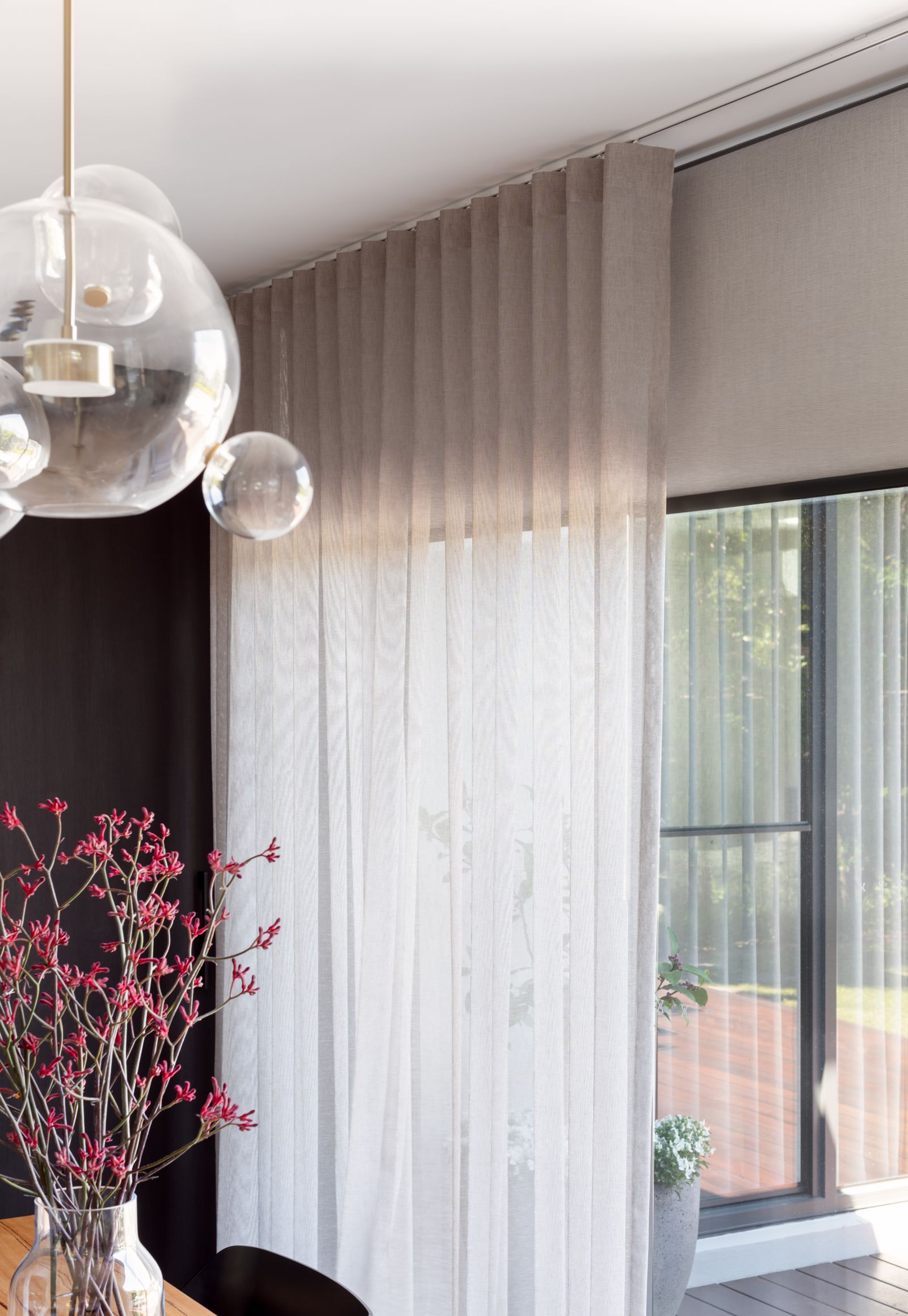 Ceiling-to-floor sheer curtains on discreet tracks in a rear extension