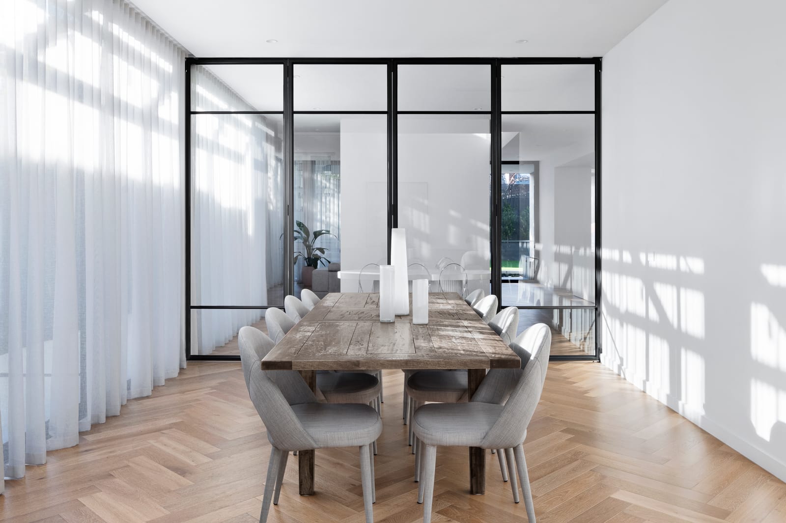Light-filled Melbourne home interior with large glazed windows