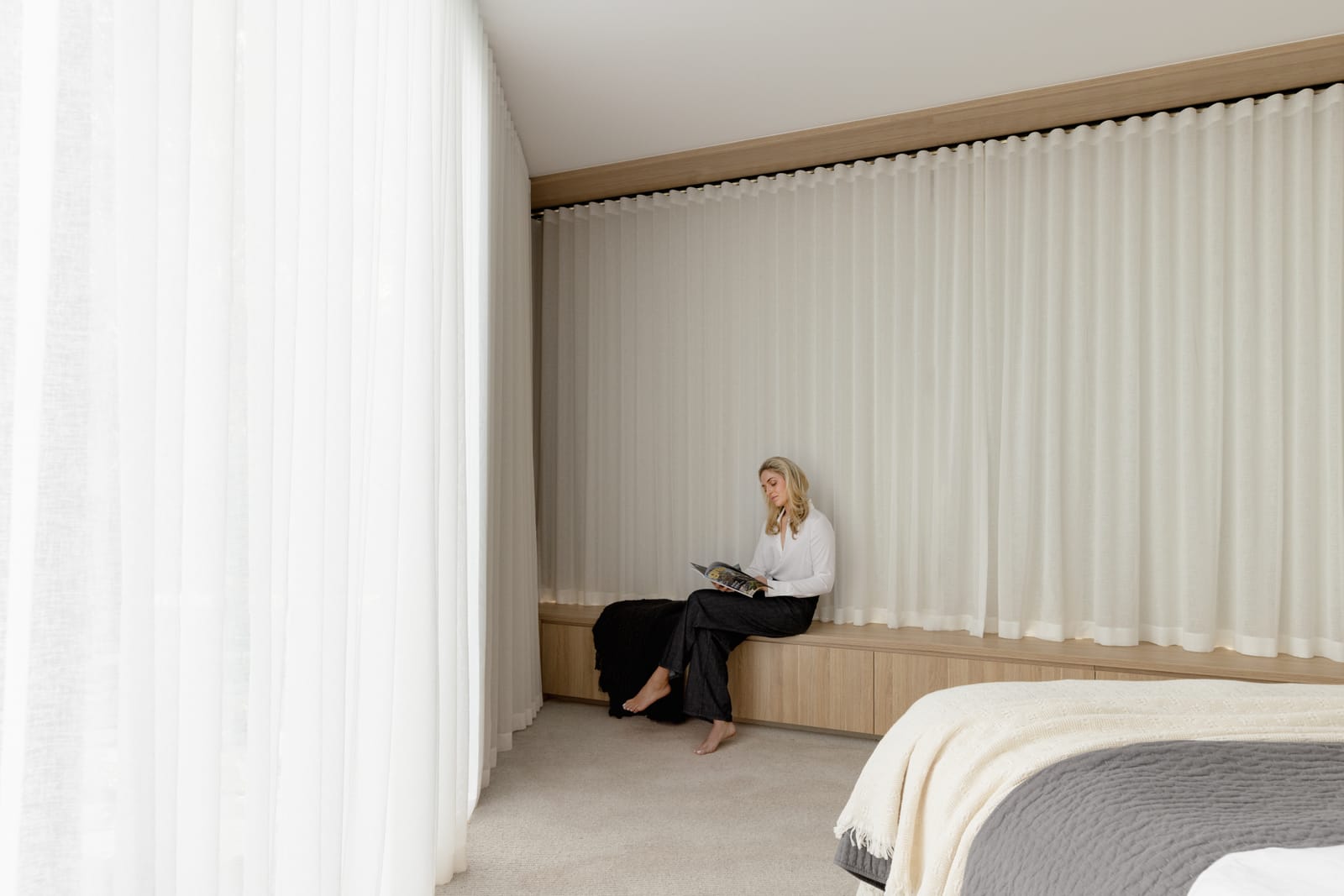 Floor-to-ceiling blockout curtains creating an insulating barrier in a Melbourne home