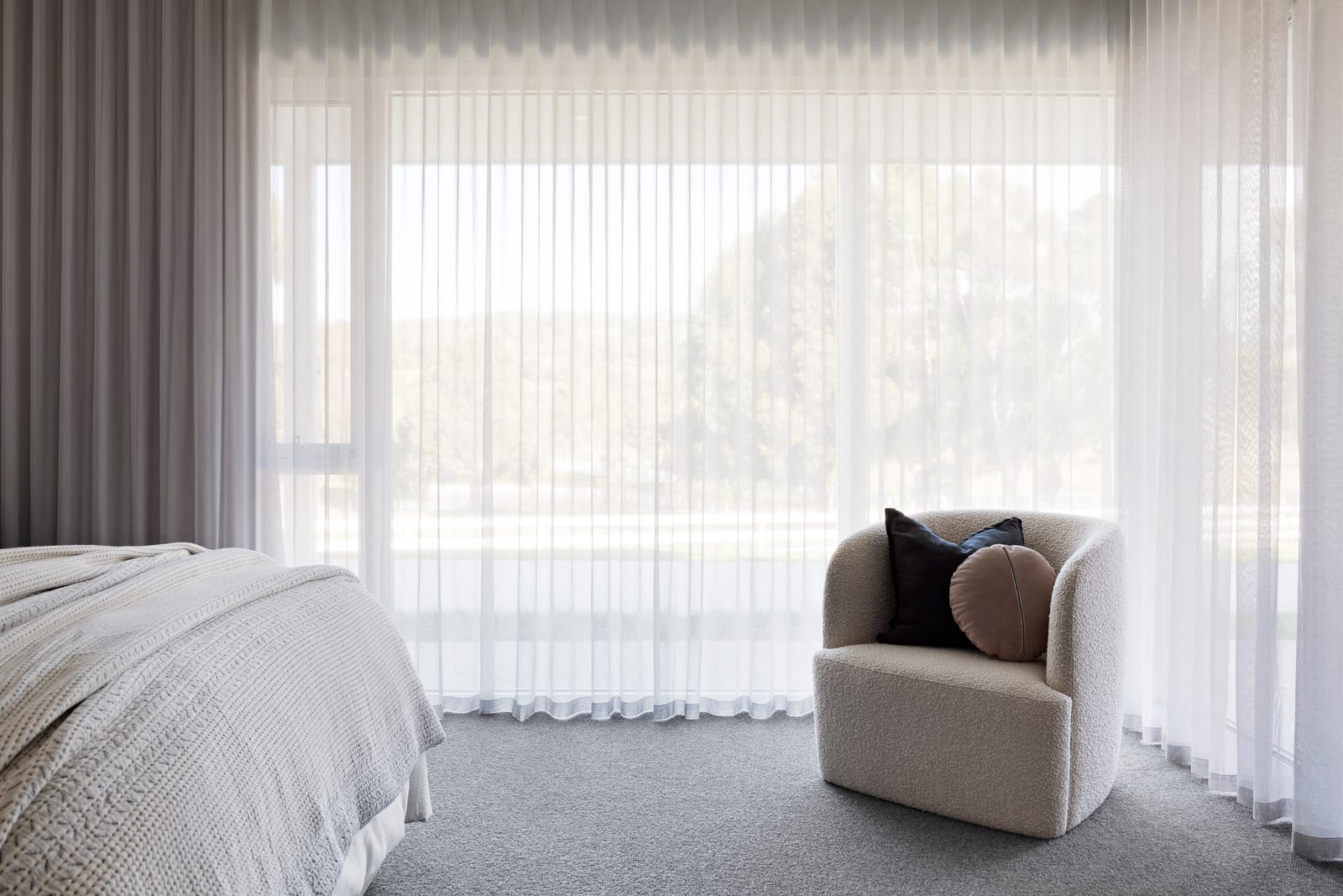 Wall-to-wall blockout curtains in a modern Melbourne living area