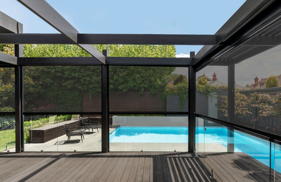 Zipscreen outdoor blinds enclosing a poolside alfresco area in Melbourne