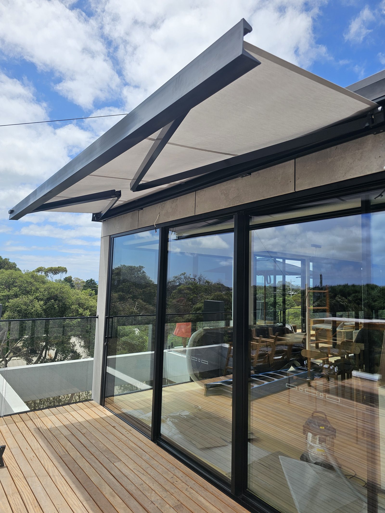 Folding arm awning shading a west-facing Melbourne deck