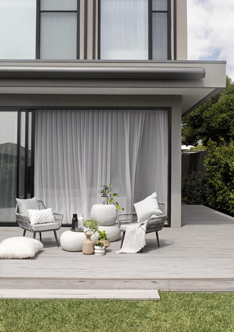 Folding arm awning extended over a Melbourne outdoor entertaining area