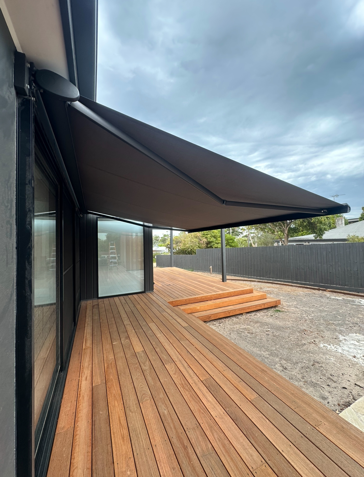 Folding arm awning installation on a Melbourne home