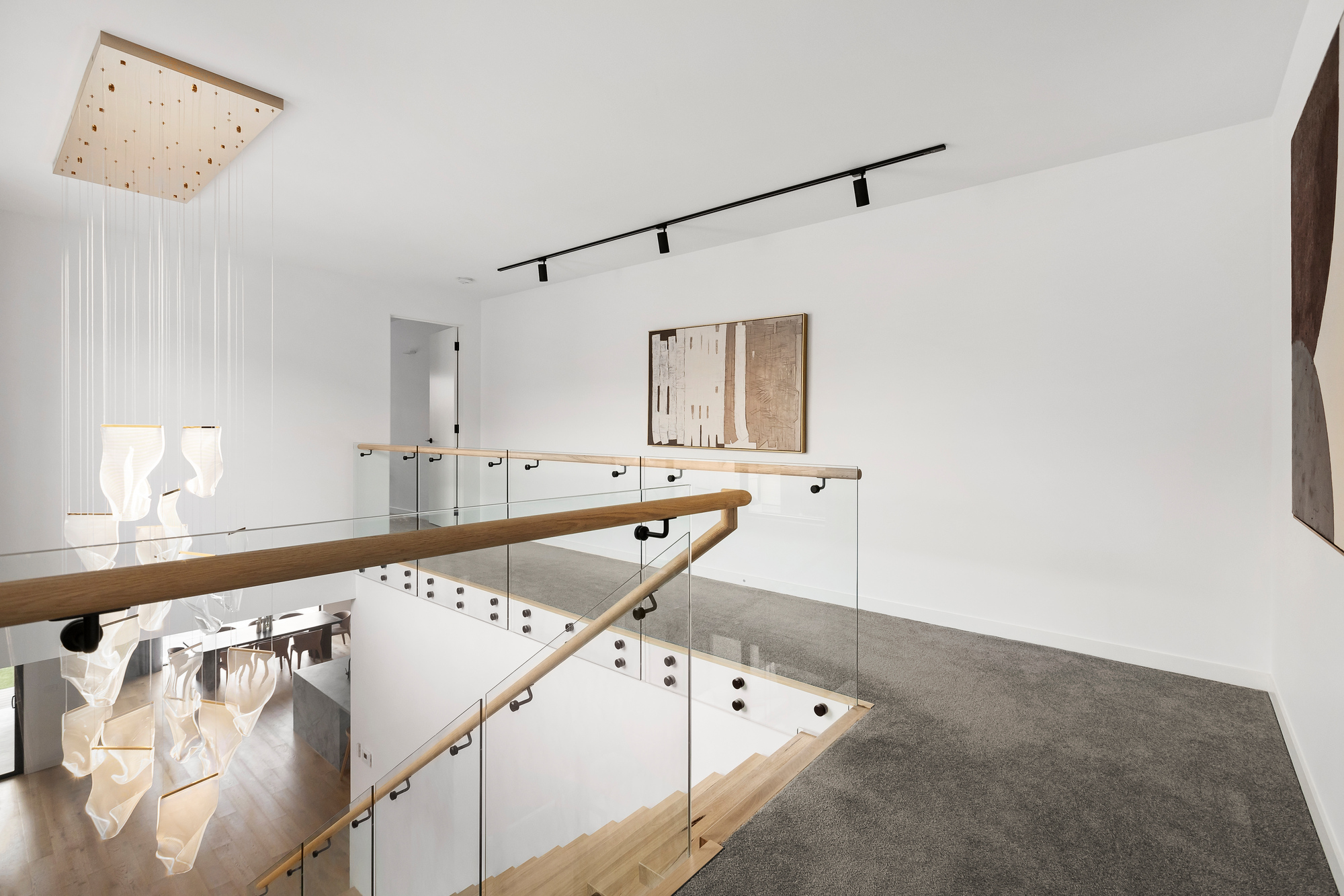 Glen Iris — six-metre void with motorised sheers and blockout roller blinds