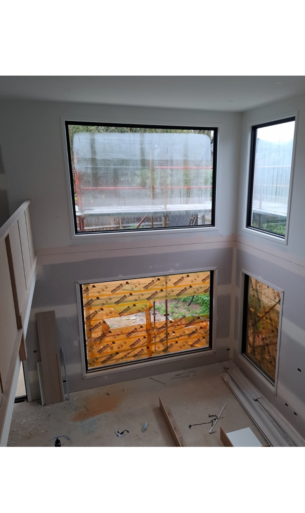 Glen Waverley — interior view of the six-metre void with motorised sheer curtains