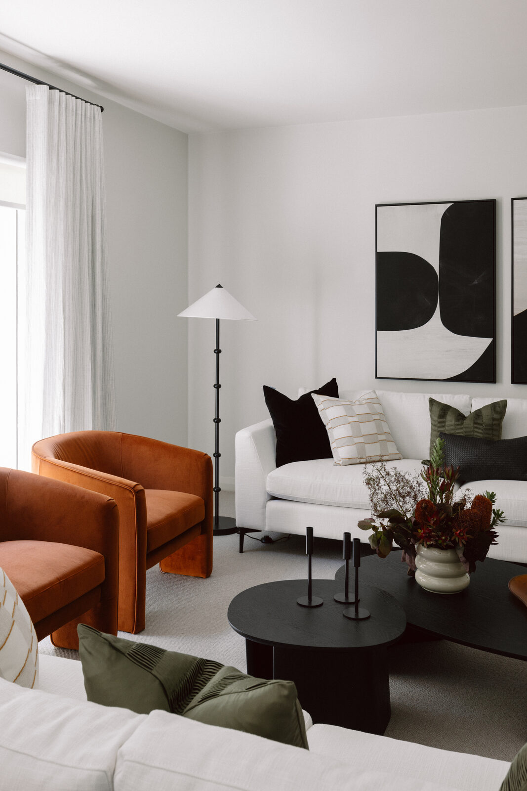 Hawthorn East — rust and velvet living room with layered window furnishings
