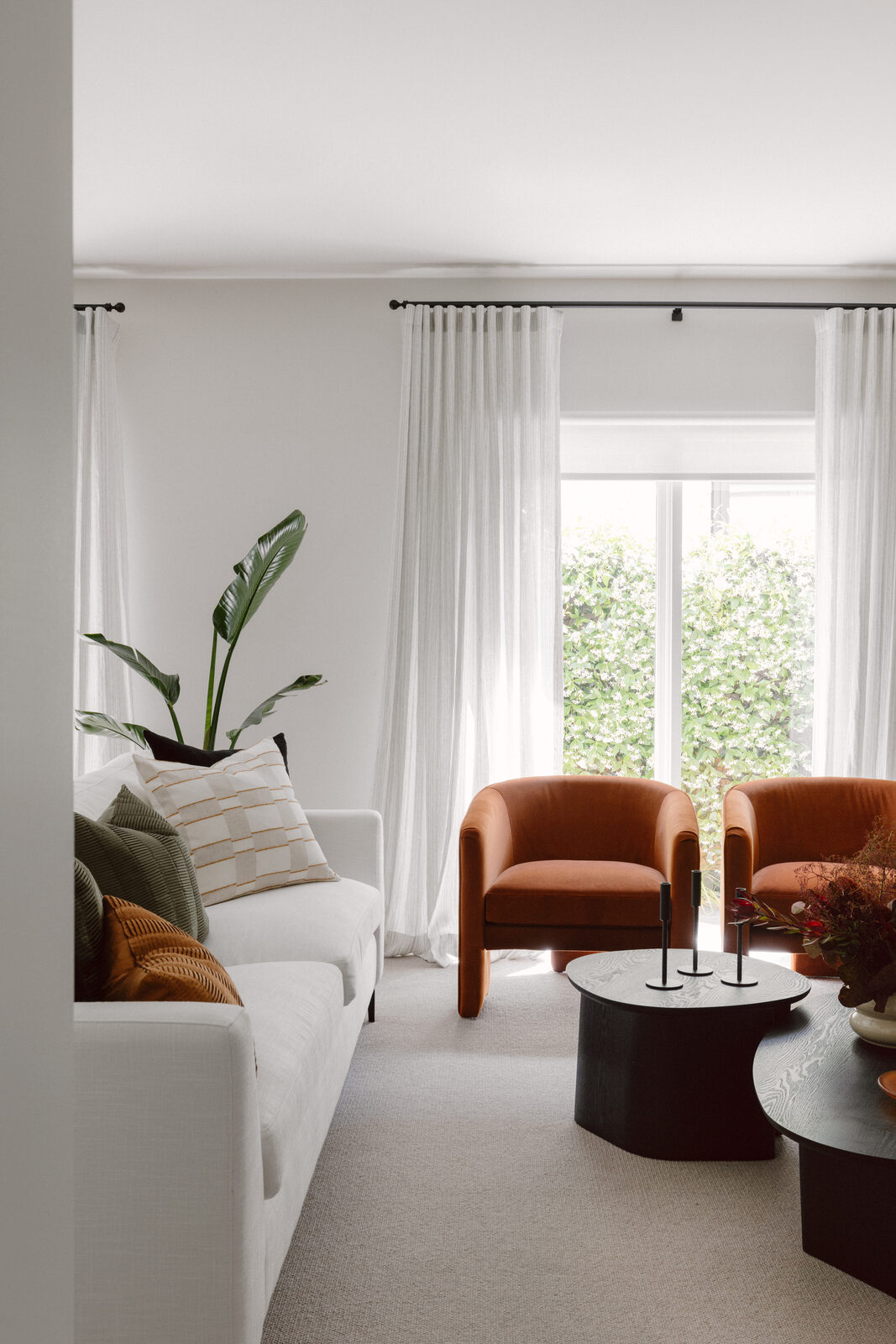 Hawthorn East — formal living room with S-fold sheer curtains on black decorative rods