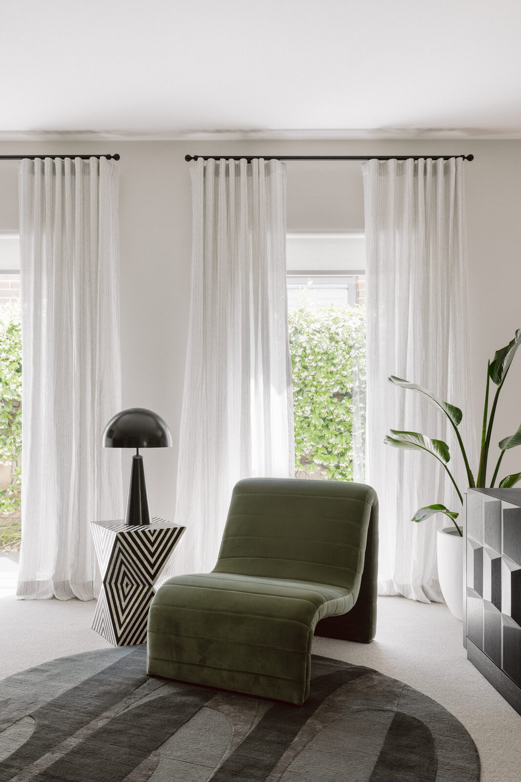 Hawthorn East — olive green sitting room with puddling linen sheers